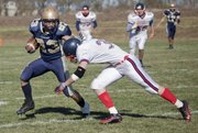 After making a reception for Veritas, Nate Scott (23) runs up field during the state championship game against St. Mary's Academy, Saturday, Nov. 6, 2010.