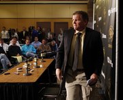 Dan Hawkins leaves a news conference Tuesday at the University of Colorado in Boulder, Colo., during which athletic director Mike Bohn announced that Hawkins had been relieved of his duties as head football coach.