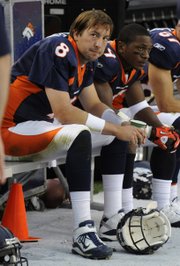 Denver Broncos quarterback Kyle Orton (8) and Eddie Royal watch the final minutes of the team's 59-14 loss to the Oakland Raiders on Oct. 24 in Denver. The Broncos play the Chiefs this weekend.