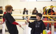Colton Smith playfully falls backwards as he is zapped by a spell from Noah Cachiguango during a Harry Potter Dance Adventures class at the Lawrence Arts Center on Thursday, Nov. 11, 2010.
