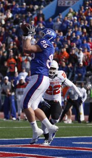 Kansas receiver Tim Biere catches a touchdown pass before Oklahoma State linebacker James Thomas during the first quarter, Saturday, Nov. 20, 2010 at Kivisto Field.