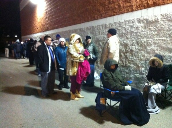 Anxious shoppers wait outside Best Buy in Lawrence hoping to score some deals early on Black Friday.