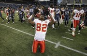Kansas City’s Dwayne Bowe celebrates at the end of the Chiefs’ 42-24 victory over the Seahawks on Sunday in Seattle.