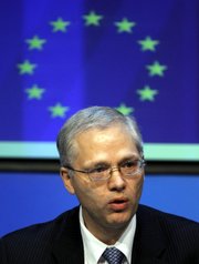 Istvan Szekely from the EU Commission speaks to the media at a press conference in Irish government buildings, Dublin, Ireland, on Sunday. EU governments have approved the basis of a $113 billion bailout deal for Ireland, Dutch Finance Minister Jan-Kees De Jager said, while saying that the IMF, with the 16 eurozone nations and the European Commission will be involved in the deal.
