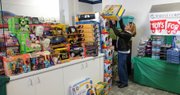 Julie Brown, with the board of directors for Douglas County Toys for Tots program, stocks the toy shop Wednesday. The program is collecting toys through the holiday season for distribution to children and families in Douglas County who otherwise might go without this holiday season.