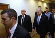 Israel's Prime Minister Benjamin Netanyahu, third left, arrives at the weekly cabinet meeting in Jerusalem on Sunday. Netanyahu has asked for nonstop, face-to-face talks with Palestinian President Mahmoud Abbas until a peace agreement is reached.