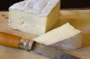Brie is soft enough to spread on crackers, this French cheese is often what diners think of when they’re told they’ll be having soft cheese. The cow’s milk cheese is encased in an edible rind and is similar to the camembert.