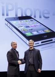 Lowell McAdam, left, Verizon President and COO, and Tim Cook, COO of Apple, announce that Verizon Wireless will carry Apple's iPhone, Tuesday, Jan. 11, 2011 in New York. Verizon Wireless and Apple@ today announced that the iPhone@ 4 will be available on the Verizon Wireless network beginning on Thursday, February 10. Qualified Verizon Wireless customers will be given the exclusive opportunity to pre-order iPhone 4 online on February 3, ahead of general availability.