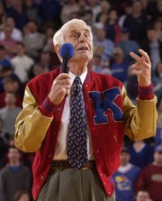 Kansas University basketball great Howard Engleman addresses the crowd with jokes and stories during halftime March 1, 2003. Engleman, whose jersey was retired, played in for KU from 1939 to 1941.