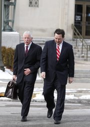 Former University of Kansas official Rodney Jones, right, leaves the U.S. Federal Courthouse in Wichita, Kan., on Friday, Jan. 14, 2011, with his attorney, Gerald Handley, after appearing in court, accused of conspiring to steal more than $2 million in tickets to athletic events.