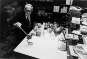 Edward Taylor handles a caecilian specimen, which is a type of amphibian. Taylor was a herpetologist and an emeritus professor of zoology at Kansas University who Rafe Brown calls the father of Philippine herpetology.