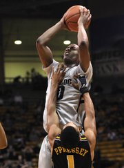 Colorado guard Alec Burks (10) shoots over Missouri guard Phil Pressey in this Jan. 8 file photo in Boulder, Colo. Burks was tapped one of The Associated Press’ top sophomores in the country who have avoided second-year slumps.