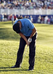 Former Kansas University golfer Gary Woodland reacts after missing his eagle chip on the 18th hole of the Palmer Private course at PGA West during the final round of the Bob Hope Classic on Sunday in La Quinta, Calif. Woodland forced a playoff, which Jhonattan Vegas won on the second hole.