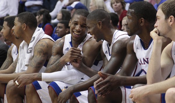 Thomas Robinson, center left, and Josh Selby, center right, enjoy the final minute of the Jayhawks' 90-66 win against the Kansas State Wildcats, Saturday, Jan. 29, 2011 at Allen Fieldhouse. Former KU star Wayne Simien had his jersey retired in a halftime ceremony at the game.