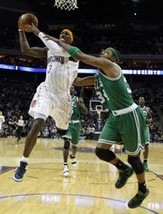 Boston’s Paul Pierce fouls Charlotte’s Gerald Wallace (3). The Bobcats defeated the Celtics, 94-89, on Monday, Feb. 7, 2011 in Charlotte, N.C.