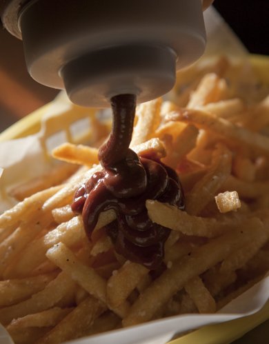 Kevin Anderson/Journal-World Photo.The Burger Stand, 803 Mass., creates a variety of signature ketchups.  Truffle fries gets some chipotle cocoa ketchup added.