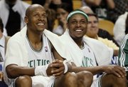 Boston Celtics’ Ray Allen, left, and Paul Pierce smile on the bench during the fourth quarter of Boston’s 112-94 victory over the Orlando Magic in the Eastern Conference semifinals on May 6, 2009, in Boston. Pierce and Allen will be taking part in the three-point shooting contest on Saturday night.
