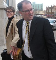 Former Kansas Attorney General Phill Kline and his wife, Deborah, arrive for a hearing before a state panel on a professional ethics complaint against him, Monday, Feb. 21, 2011, in Topeka, Kan. The complaint before a three-member panel of the state Board for Discipline of Attorneys stems from Kline's investigations of abortion providers while in office.
