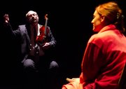 Charles Goolsby, left, and Liza Pehrson rehearse a scene from "Opus." The play follows a world class string quartet that has just fired one of its members and is struggling to adjust to its talented new musician days before a televised performance at the White House.