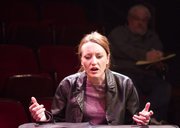 Liza Pehrson, rehearses a scene from the play "Opus" as director Doug Weaver watches in the background.