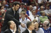 Oklahoma City Thunder forward Nick Collison shakes hands with broadcaster Bob Davis at the Lloyd Noble Center on Saturday, Feb. 26, 2011 at the Lloyd Noble Center in Norman, Okla.