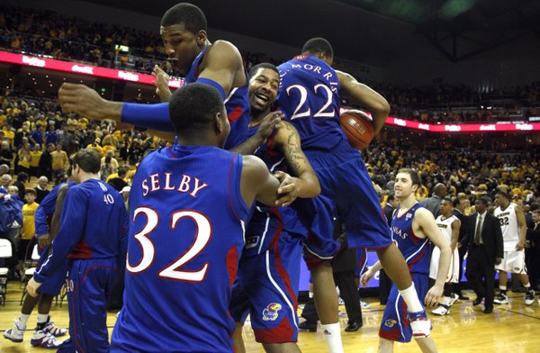 Kansas players Josh Selby, Thomas Robinson, Markieff Morris and Marcus Morris (22) collide in celebration on the court after defeating Missouri 70-66 and clinching the outright Big 12 conference championship Saturday, March 5, 2011 at Mizzou Arena.