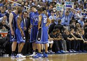 Coach Mike Krzyzewski, center, Directs the Blue Devils against North Carolina in the championship game of the 2011 ACC tournament in Greensboro, N.C.