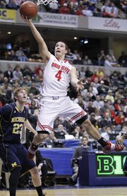 Ohio State guard Aaron Craft (4) goes up for a layup in the first half of a Big Ten tournament game against Michigan.