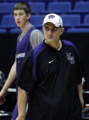 Kansas State coach Frank Martin watches his team during a practice on Wednesday in Tucson, Ariz. The Wildcats will face Utah State approximately 8:57 tonight in Tucson.