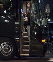 Kansas coach Bill Self exits the team bus after arriving at the Renaissance Hotel on Wednesday in Tulsa, Okla.
