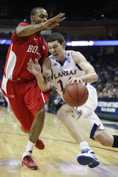 Kansas guard Tyrel Reed drives against Boston University guard Darryl Partin during the first half on Friday, March 18, 2011 at the BOK Center in Tulsa.