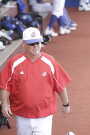 KU baseball coach Ritch Price paces in the dugout during the Jayhawks game against University of Arkansas Little-Rock on Tuesday, March 22, 2011, at Hoglund Ballpark.