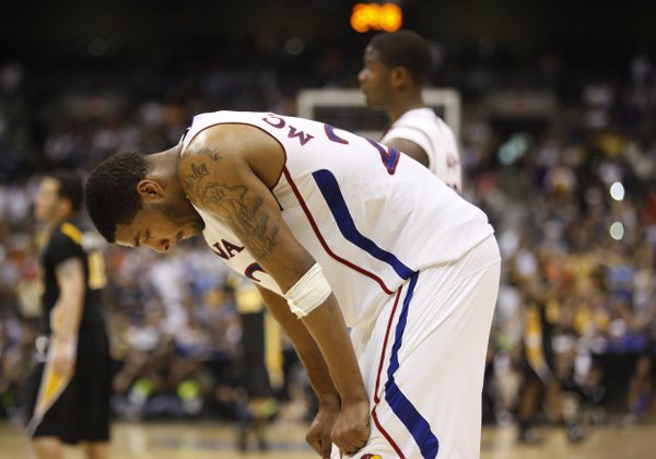 Kansas forward Marcus Morris hangs his head in the waning moments of the Jayhawks' loss to Virginia Commonwealth on Sunday, March 27, 2011 at the Alamodome in San Antonio.