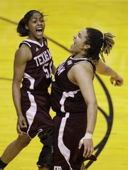 Texas A&M players Sydney Colson, left, and Danielle Adams celebrate their 63-62 win over Stanford. A&M won Sunday in Indianapolis to advance to Tuesday’s national championship.