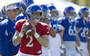 Kansas quarterback Jordan Webb looks over his receivers as he runs through plays with the offense during practice on Monday, April 11, 2011 at the KU practice fields.