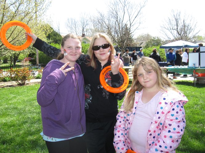 From left, Erica King, 11, Carly McClung, 11, and Abby King, 6, all of Lawrence, enjoy the Earth Day Celebration on Saturday, April 16, 2011, in South Park.