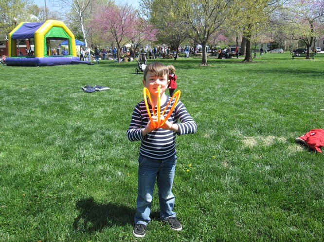 Milo Bitters, 6, of Lawrence, was tossing three Frisbees at a time during the Earth Day Celebration in South Park.