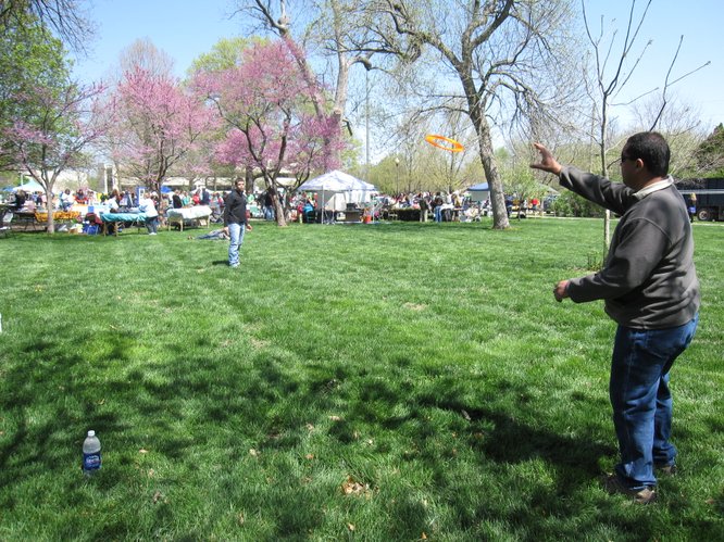 William Bond, left, throws a Frisbee to his father, Billy. They were enjoying the Earth Day festivities in South Park. They both are from Basehor.
