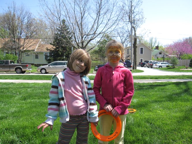 Ava Lee, 4, left, and Lulu Myers-Arenth, 6, both of Lawrence, enjoy the Earth Day festivities in South Park.