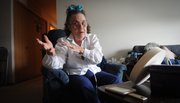 Connie Downey, a former real estate agent who saw her savings erode when she was diagnosed with lung disease sits in her Bellevue, Neb., home April 15, 2011. Downey says she is now on the cusp of qualifying for food stamps.
