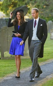 Britain's Prince William and Kate Middleton leave the wedding of their friends Harry Mead and Rosie Bradford in the village of Northleach, Gloucestershire, England on Oct. 23, 2010. William and Kate will be married April 29, 2011.