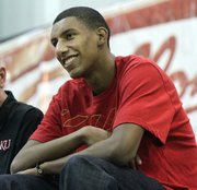 Kevin Young watches the alumni scrimmage during the Bill Self basketball game on Wednesday at Horejsi Center.