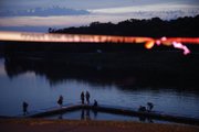 Douglas County Underwater Search and Recovery Team members search the swim beach area at Lone Star Lake for a missing 7-year-old Kansas City, Mo., boy on Saturday, June 2, 2011. The crew suspended their search for the night due to darkness. They found the boy's body on Sunday.