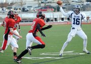Valor Christian quarterback Brock Berglund, right, scrambles away from Steamboat defenders in this 2009 photo from the Class 3A state championship football game in Aurora, Colo. Berglund signed to play football at Kansas University on Jan. 4, 2011.
