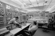 This April 8, 1983, photo shows people in the control room of the Indian Point nuclear power plant in Buchanan, N.Y. Commercial nuclear reactors in the United States were designed and licensed for 40 years. When the first ones were being built in the 1960s and 1970s, it was expected that they would be replaced with improved models long before those licenses expired. Instead, 66 of the 104 operating units have been relicensed for 20 more years, mostly with scant public attention. As of 2011, renewal applications are under review for 16 other reactors. Applications to extend the lives of pressurized water units 2 and 3 at Indian Point, each more than 34 years old, are under review by the NRC.