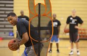 Former Kansas University forward Wayne Simien makes his way through a basketball drill at his Called to Greatness camp last summer.