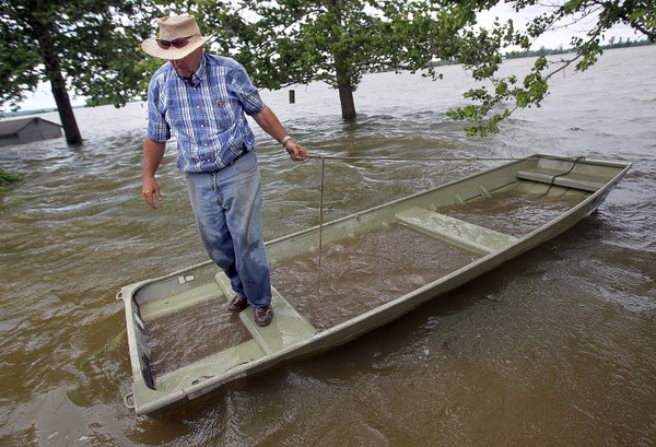 Steve Johansen carefully walks across the jon boat he retrieved from 