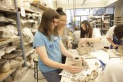 Elise Ruhlman, 13, Lawrence receives instructions from visiting artist Akiko Jackson during a Sculpting with Clay course at the Lawrence Arts Center.
