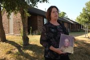 Katie Gillam stands in front of the Egdewood apartment where her father, Robert Conlin, was burglarized and beaten on May 21, 1977. Conlin, a local restaurateur died several days later, the beating having contributed to his death. The case has yet to be solved.