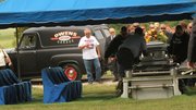 Tom Owens, Tonganoxie, left, pauses after driving his 1955 Ford Panel truck serving as the hearse carrying the remains of his nephew, Nick Owens, to the cemetery Wednesday.